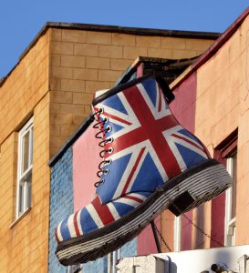 "London, UK - January, 9th 2013:A large boot decorated with the British flag on display above street level in the Camden Market area of LondonCamden market is well known for many of these large effigies on display above the shops and restaurants as it is a popular tourist area of London."